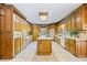 Spacious kitchen with island and ample wood cabinetry at 3651 Chandler Haulk Rd, Loganville, GA 30052