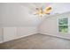 Bedroom with ceiling fan, carpet, and window at 3651 Chandler Haulk Rd, Loganville, GA 30052