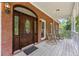 Front porch with rocking chairs and a large front door at 3651 Chandler Haulk Rd, Loganville, GA 30052