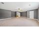 Spacious bedroom with neutral walls and carpet, and ensuite bathroom at 3651 Chandler Haulk Rd, Loganville, GA 30052