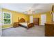 Bright bedroom with wood furniture and carpeting at 3651 Chandler Haulk Rd, Loganville, GA 30052