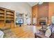 Living room with hardwood floors, high ceilings, and a brick fireplace at 3651 Chandler Haulk Rd, Loganville, GA 30052