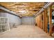 Unfinished basement with exposed ceiling and concrete floor at 3651 Chandler Haulk Rd, Loganville, GA 30052