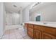 Bathroom with shower/tub combo, vanity, and tile flooring at 3651 Chandler Haulk Rd, Loganville, GA 30052