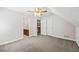 Bedroom with attached bathroom and carpet at 3651 Chandler Haulk Rd, Loganville, GA 30052