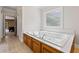 Main bathroom with a luxurious jetted tub at 3651 Chandler Haulk Rd, Loganville, GA 30052