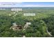 Aerial view of home, creek, and road at 3651 Chandler Haulk Rd, Loganville, GA 30052