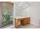 Bathroom with vanity and a window overlooking the backyard at 3651 Chandler Haulk Rd, Loganville, GA 30052