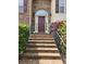 Brick home with a charming front entrance and landscaping at 6561 Harrington Pl, Douglasville, GA 30135