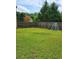 Fenced backyard with grassy area and playset at 6561 Harrington Pl, Douglasville, GA 30135