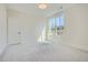 Spacious bedroom with neutral walls, carpeted floors, and a large window at 4215 Tattnall Run, Acworth, GA 30101