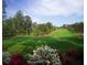Picturesque golf hole with azaleas in the foreground at 4215 Tattnall Run, Acworth, GA 30101