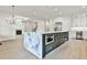 Modern kitchen with large marble island and built-in appliances at 4215 Tattnall Run, Acworth, GA 30101