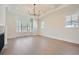 Bright living room with hardwood floors, large windows, and a fireplace at 4215 Tattnall Run, Acworth, GA 30101