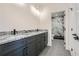 Elegant bathroom with dark gray cabinets, granite countertop, and a walk-in shower at 4215 Tattnall Run, Acworth, GA 30101