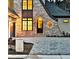 Luxury home with stone accents and three-car garage at dusk at 4215 Tattnall Run, Acworth, GA 30101