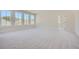 Spacious bedroom with large windows, carpet, and a view of the backyard at 4215 Tattnall Run, Acworth, GA 30101