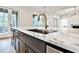 Modern kitchen island with marble countertop and gold faucet at 4215 Tattnall Run, Acworth, GA 30101