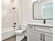 Bathroom with geometric tile shower, white vanity, and a modern toilet at 4215 Tattnall Run, Acworth, GA 30101