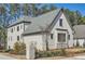 White brick home with gray roof and landscaping at 4215 Tattnall Run, Acworth, GA 30101