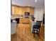 Kitchen with an island, hardwood floors, and ample cabinetry at 9904 Hamilton Dr, Douglasville, GA 30135