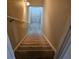 Carpeted stairs leading down to the basement at 9904 Hamilton Dr, Douglasville, GA 30135