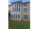 Two story home with large windows and beige siding at 9904 Hamilton Dr, Douglasville, GA 30135