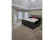 Spacious main bedroom with high ceilings and a large bed at 9904 Hamilton Dr, Douglasville, GA 30135