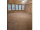 Large bedroom with bay windows and wall-to-wall carpeting at 9904 Hamilton Dr, Douglasville, GA 30135