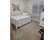 Bright bedroom with a double bed, window coverings, and neutral carpeting at 9904 Hamilton Dr, Douglasville, GA 30135