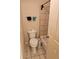 Small bathroom with a toilet, bathtub, and tiled floor at 9904 Hamilton Dr, Douglasville, GA 30135