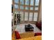 Sunlit living room with hardwood floors and large windows at 9904 Hamilton Dr, Douglasville, GA 30135