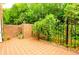 Private brick patio with lush green landscaping at 3081 Howell Mill Nw Rd # 3, Atlanta, GA 30327