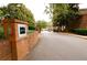 Gated community entrance with brick pillars and intercom at 3081 Howell Mill Nw Rd # 3, Atlanta, GA 30327