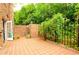 Private brick patio with lush green landscaping at 3081 Howell Mill Nw Rd # 3, Atlanta, GA 30327