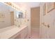 Bathroom features updated vanity, shower/tub combo, and pink tile floors at 3081 Howell Mill Nw Rd # 3, Atlanta, GA 30327