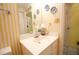 Small bathroom with yellow striped wallpaper and white vanity at 3081 Howell Mill Nw Rd # 3, Atlanta, GA 30327