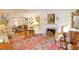 Spacious living room featuring hardwood floors, a fireplace, and antique furniture at 3081 Howell Mill Nw Rd # 3, Atlanta, GA 30327