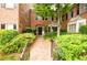 Welcoming front entrance with brick facade and landscaping at 3081 Howell Mill Nw Rd # 3, Atlanta, GA 30327