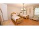 Charming bedroom with hardwood floors and antique twin beds at 3081 Howell Mill Nw Rd # 3, Atlanta, GA 30327