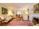 Living room with hardwood floors, antique furniture and view to dining room at 3081 Howell Mill Nw Rd # 3, Atlanta, GA 30327