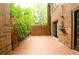 Private brick patio with lush green landscaping at 3081 Howell Mill Nw Rd # 3, Atlanta, GA 30327