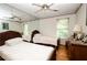 Bright bedroom with two twin beds, mirrored wall, and hardwood floors at 3081 Howell Mill Nw Rd # 3, Atlanta, GA 30327