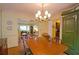 Bright dining room features hardwood floors, chandelier, and built-in hutch at 3081 Howell Mill Nw Rd # 3, Atlanta, GA 30327
