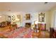 Spacious living room featuring hardwood floors, a fireplace, and antique furniture at 3081 Howell Mill Nw Rd # 3, Atlanta, GA 30327