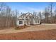 Two-story house with white siding and stone accents at 3730 Reserve Overlook (Lot 8) Way, Cumming, GA 30041