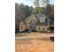 Two-story house with gray roof and yellow siding at 3730 Reserve Overlook (Lot 8) Way, Cumming, GA 30041