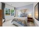 Spacious bedroom with large window and cozy bedding at 263 Arwen Drive Lot 65, Mcdonough, GA 30252