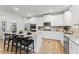 Modern kitchen with white cabinets and granite countertops at 263 Arwen Drive Lot 65, Mcdonough, GA 30252
