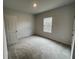 Bedroom with window and carpet flooring at 263 Arwen Drive Lot 65, Mcdonough, GA 30252
